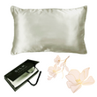 The Ardor Mulberry Silk Standard Pillowcase Silver Nights displayed alongside its packaging and a decorative flower, suggesting a luxurious and elegant product intended for comfort and style in bedroom decor.