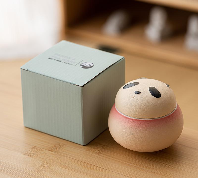 The Artisanal Animal-Shaped Ceramic Tea Storage Jar with Gift Box - 140ml Capacity, Textured Finish (Gradient Red), featuring a charming panda design inspired by wildlife aesthetics, adding personality and decorative appeal.