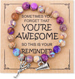 The Cheerleader Encouragement Bracelet – Imperial Stone Charm Bracelet with Inspirational Card Gift, a beaded bracelet with charms on a cardboard backing with motivational quote