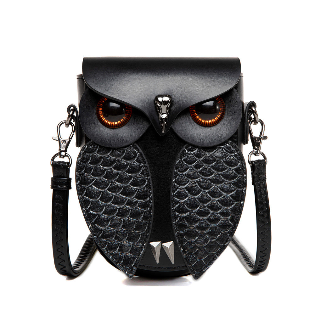 Creative Owl Crossbody Shoulder Bag – Compact Statement Design, Cruelty-Free Faux Leather (Black), featuring a black owl-shaped handbag with a detailed design on a white background