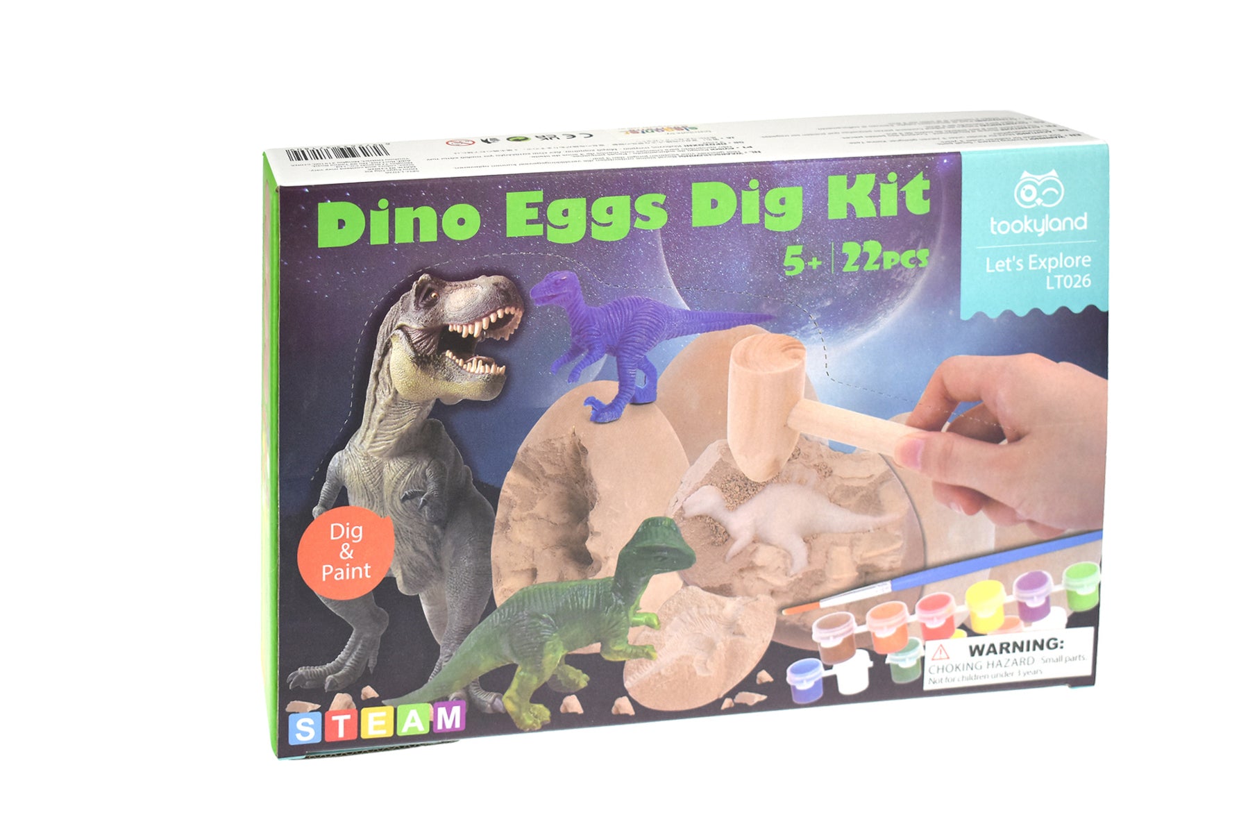 Packaging for Dinosaur Eggs Dig Kit with illustrations of dinosaurs and a person using a wooden pick and paintbrush on an egg.
