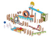The Domino Run Building Set - Large, with building pieces arranged for a domino run, including various shapes and elements such as steps, ramps, and marbles.