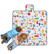 Two children are colouring on the Happy Kids Monster Squad Colour Me In Picnic Blanket 125 x 125 cm