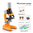 Orange Kids Biological Microscope set with specimens and tools on a white background