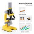 Yellow Kids Biological Microscope set with specimens and tools on a white background