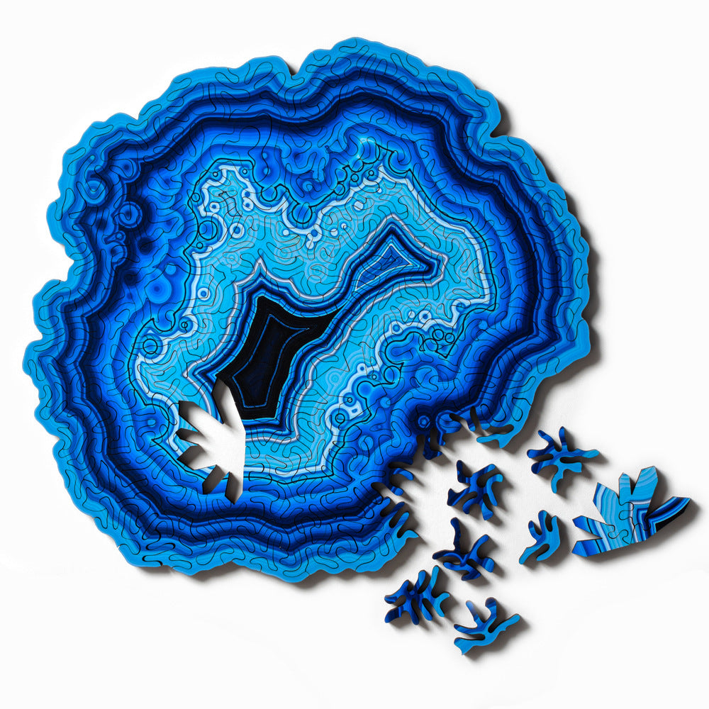 Ocean Blue Algorithmic Agate Jigsaw Puzzle geode with unique pieces on a white background