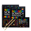 Three rainbow scratch paper notebooks with a wooden stick on a white background