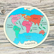 Seven Continents Wooden Jigsaw Puzzle for learning set on a wooden surface