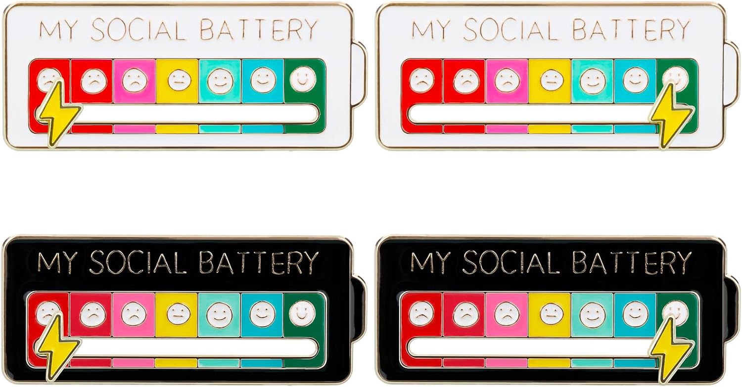 The Social Battery Mood Pin Set 4 Pack – Family Edition Adjustable Emotion Brooch Badges (2 Black & 2 White) featuring four colourful battery-themed pins with 'My Social Battery' text and smiley face indicators.