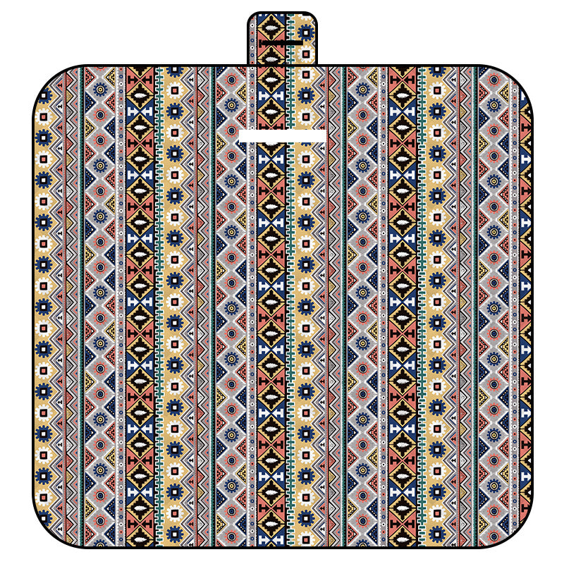 Patterned picnic blanket with a bohemian geometric design on a white background