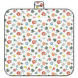 Floral patterned picnic mat with a handle on a white background